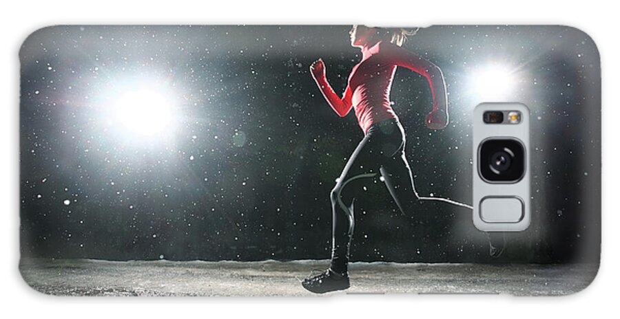 Adolescence Galaxy Case featuring the photograph Woman Running At Night In Snow by Stanislaw Pytel