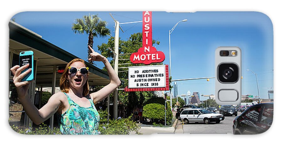 Austin Local Galaxy Case featuring the photograph An Austin local takes a selfie in front of the famous Austin Motel Sign in South Congress, Austins most eclectic and most popular spots for live music, dining, and unique shopping by Dan Herron