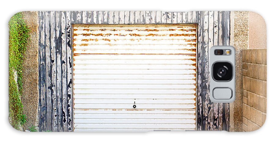 Abandoned Galaxy Case featuring the photograph Old garage door by Tom Gowanlock