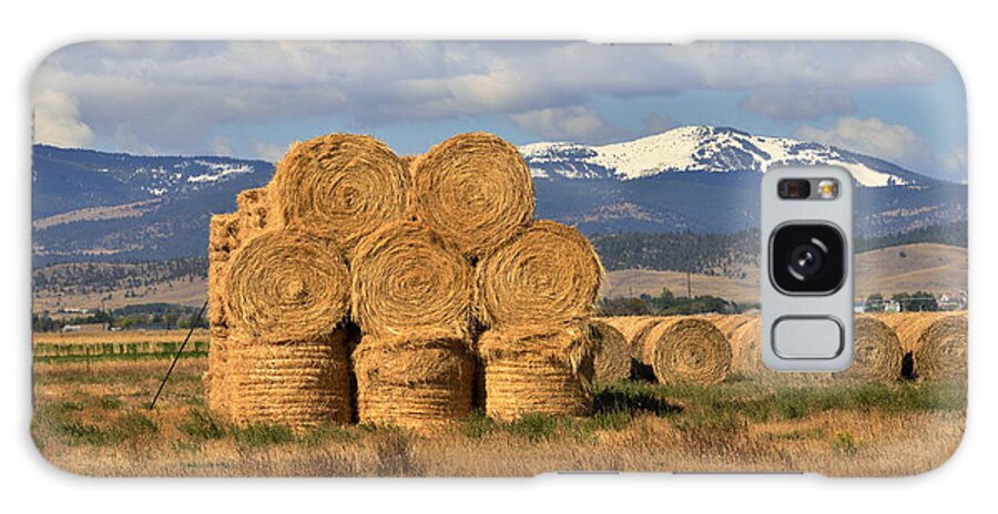 Hay Bales Galaxy Case featuring the photograph Round Hay Bales and Mountain by Kae Cheatham