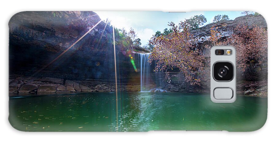 Hamilton Pool Nature Preserve Galaxy Case featuring the photograph Sun rays shimmer through the cliffs at Hamilton Pool Nature Preserve as a beautiful 50-foot waterfall cascades down the pool by Dan Herron