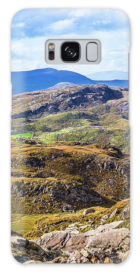 Blue Galaxy Case featuring the photograph Undulating green, purple and yellow rocky landscape in Ireland by Semmick Photo