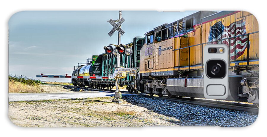 Union Pacific; Building America; Frieght Train; Train Cars; Train Crossing; Train Signal; Railway; Railroad Crossing; Yellow; Red; Blue; Green; Mojave Desert; Mohave Desert; Antelope Valley; California; Joe Lach Galaxy S8 Case featuring the photograph Union Pacific by Joe Lach