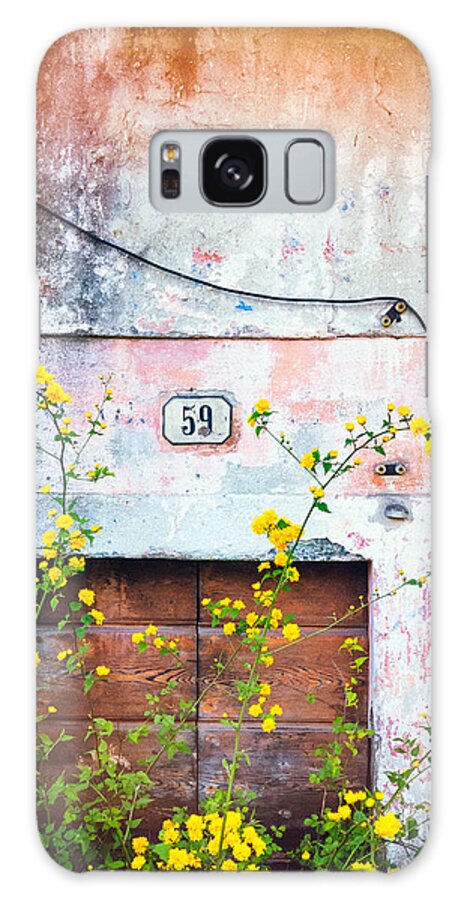 Architecture Galaxy S8 Case featuring the photograph Yellow flowers and decayed wall by Silvia Ganora