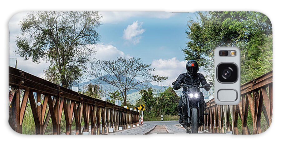 Motorcycle Galaxy Case featuring the photograph Man Riding His Motorcycle Over Temporary Bridge In North Thailand #1 by Cavan Images