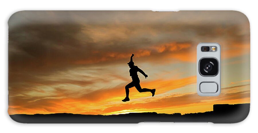 Environment Galaxy Case featuring the photograph Silhouette Of Man Jumping With Cap In The Sunset #1 by Cavan Images