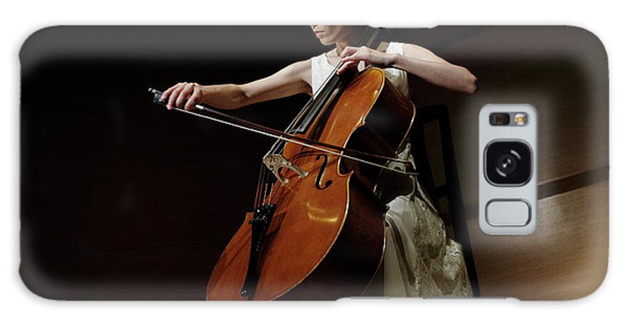 Mature Adult Galaxy Case featuring the photograph A Female Cellist Playing Cello On Stage by Sot