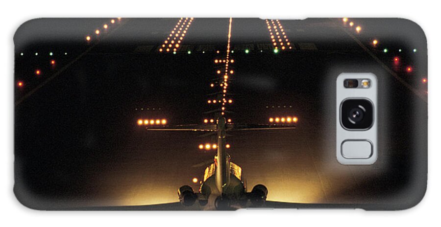 Taking Off Galaxy Case featuring the photograph Airplane On Runway At Night by Comstock