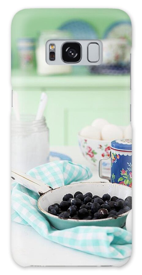 Ip_11256472 Galaxy Case featuring the photograph Blueberries In An Enamel Pan On A Blue And White Napkin With Quark And Eggs In The Background by Syl Loves