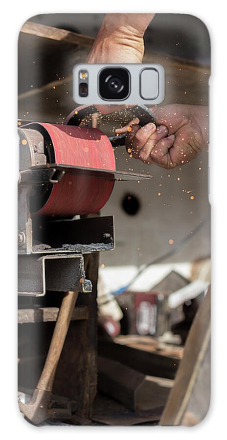 Farrier Galaxy Case featuring the photograph Close Up Of Farrier Grinding Horseshoe by Cavan Images