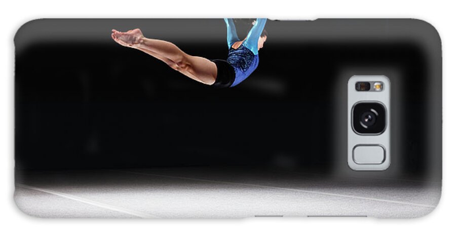 Human Arm Galaxy Case featuring the photograph Female Gymnast Jumping Through Air by Robert Decelis Ltd