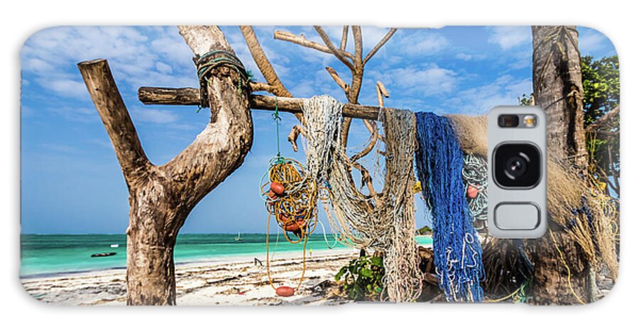 Beach Galaxy Case featuring the photograph Fishing nets drying on the beach by Lyl Dil Creations