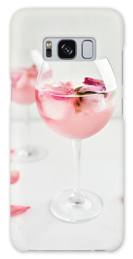 Ip_12670085 Galaxy Case featuring the photograph Gin And Tonic Cocktail With Rose Infused Tonic And Frozen Roses by Natasa Dangubic