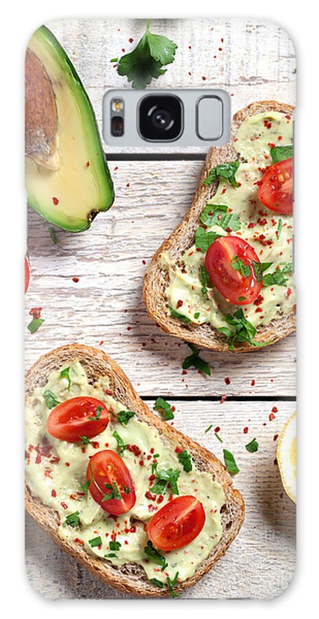 Breakfast Galaxy Case featuring the photograph Healthy Whole Grain Bread With Avocado by Barcin