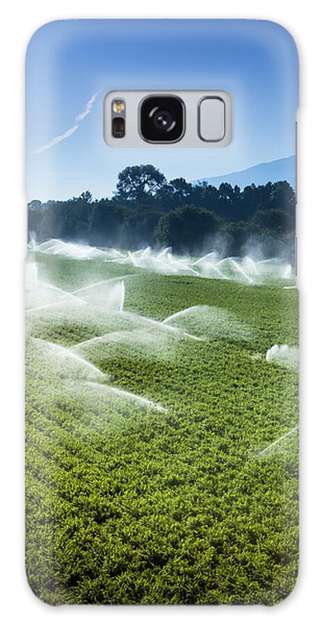 Environmental Conservation Galaxy Case featuring the photograph Irrigation Sprinkler Watering Crops On by Pgiam