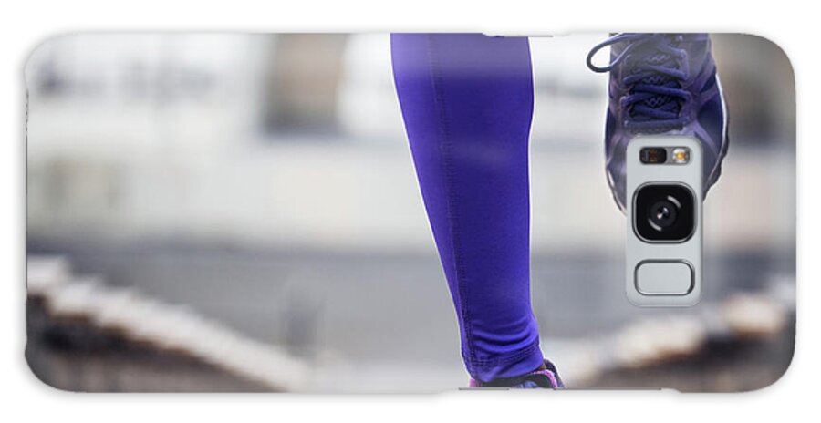 Sporty Galaxy Case featuring the photograph Low Section Of Sporty Woman Running At Stadium by Cavan Images