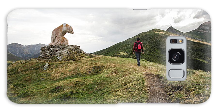 Man Galaxy Case featuring the photograph Man Walking In The Mountain Next To Bear Statue Picos De Europa by Cavan Images