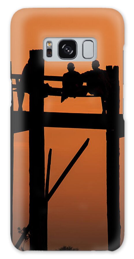 Orange Color Galaxy Case featuring the photograph Monks Resting On Uben Bridge - Myanmar by Copyright Pascal Carrion