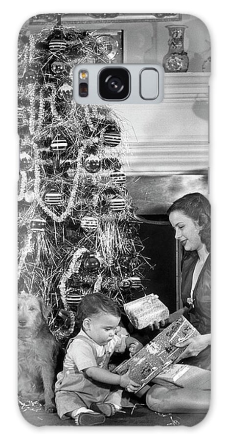 Pets Galaxy Case featuring the photograph Mother And Child Opening Christmas Gifts by George Marks