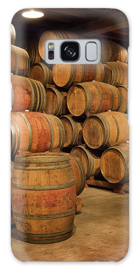 Fermenting Galaxy Case featuring the photograph Old Wine Barrels Stacked In Winery by Yinyang