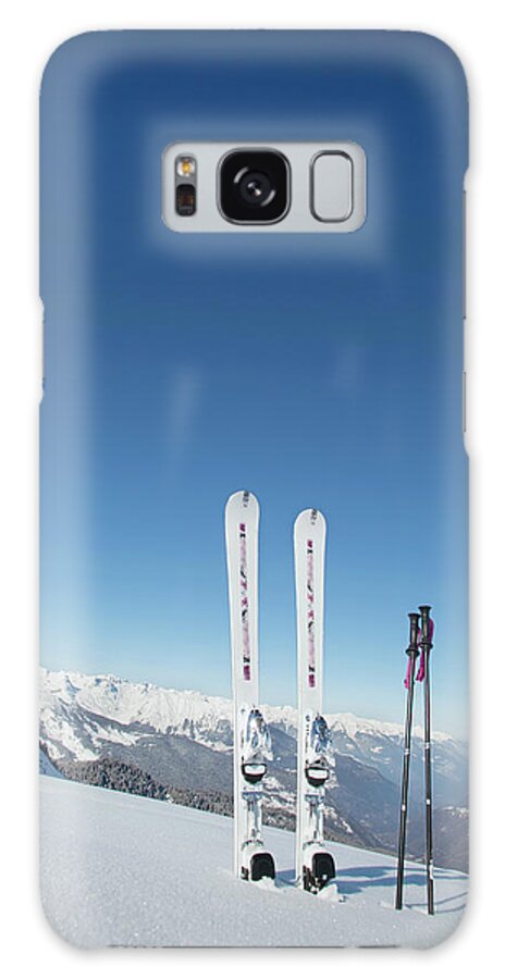 Ski Pole Galaxy Case featuring the photograph Skis And Ski Poles Stuck In The Snow by L.a. Novia