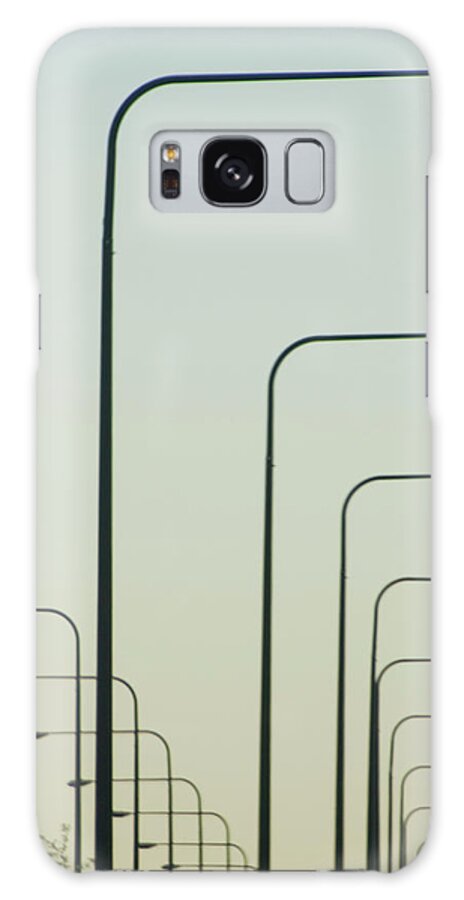 In A Row Galaxy Case featuring the photograph Streetlights Against Afternoon Sky by By Ken Ilio