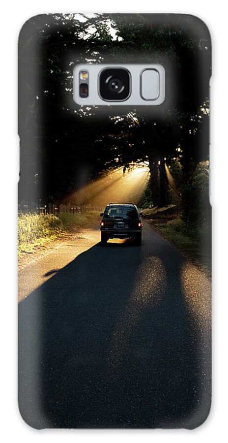 Suv Galaxy Case featuring the photograph Suv Parked On Roadway Leading Into Sun Rays Being Cast Through Trees by Cavan Images