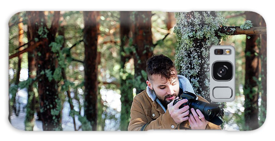 Sea Galaxy Case featuring the photograph Tourist In The Mountains Resting With His Camera by Cavan Images