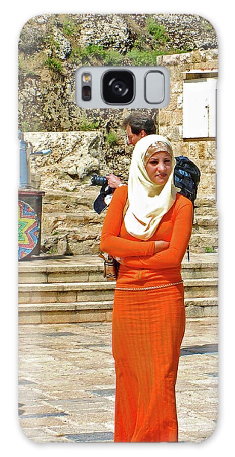 Woman In A Bright Orange Dress By Ajlun Castle Galaxy Case featuring the photograph Woman in a Bright Orange Dress by Ajlun Castle, Jordan by Ruth Hager