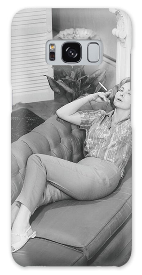 Smoking Galaxy Case featuring the photograph Woman Relaxing On Sofa, B&w, Elevated by George Marks