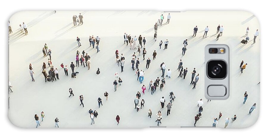 Above Galaxy Case featuring the photograph Group of people gather and walk in the city, aerial view of a cr #1 by Joaquin Corbalan