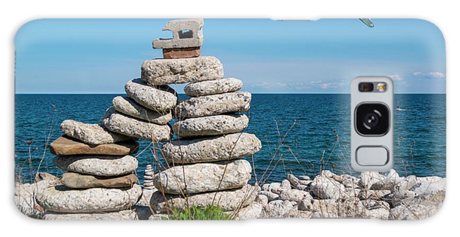 Inukshuk Galaxy Case featuring the photograph Large Inukshuk by a Lake with Parasailor by John Twynam