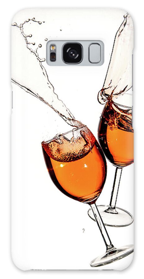 Alcohol Galaxy Case featuring the photograph Red wine in glasses with splashes on a white background isolated by Michalakis Ppalis
