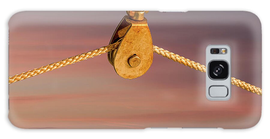 Closeup Galaxy Case featuring the photograph Rope on Pulley Against Blue Background by Darryl Brooks