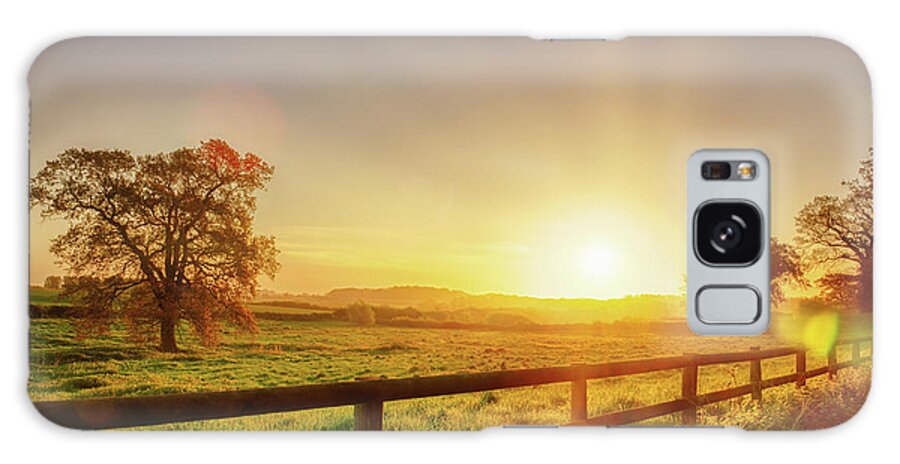 Britain Galaxy Case featuring the photograph Rural sunrise over fenced field by Simon Bratt