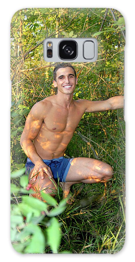 Young Galaxy Case featuring the photograph Young handsome man poses in the forest half-naked. by Gunther Allen