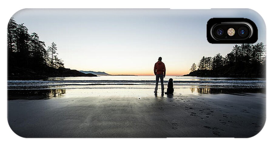Water's Edge iPhone X Case featuring the photograph A Man And His Dog On A Beach At Sunset by Alasdair Turner