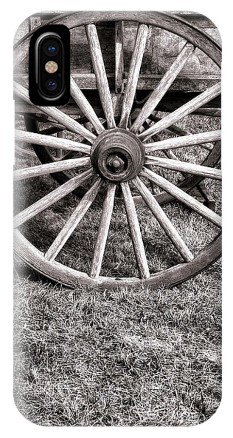 Schooner iPhone X Case featuring the photograph Old Wagon Wheel on Cart by Olivier Le Queinec