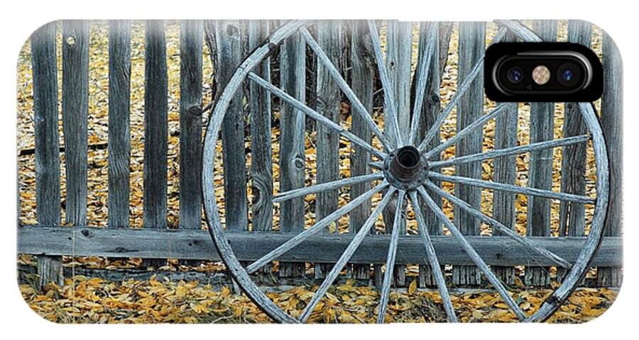 Montana iPhone X Case featuring the photograph Golden Leaves and Old Wagon Wheel Against a Fence by Bruce Gourley