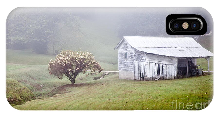Abandoned iPhone X Case featuring the photograph Old Weathered Wooden Barn in Morning Mist by Jo Ann Tomaselli