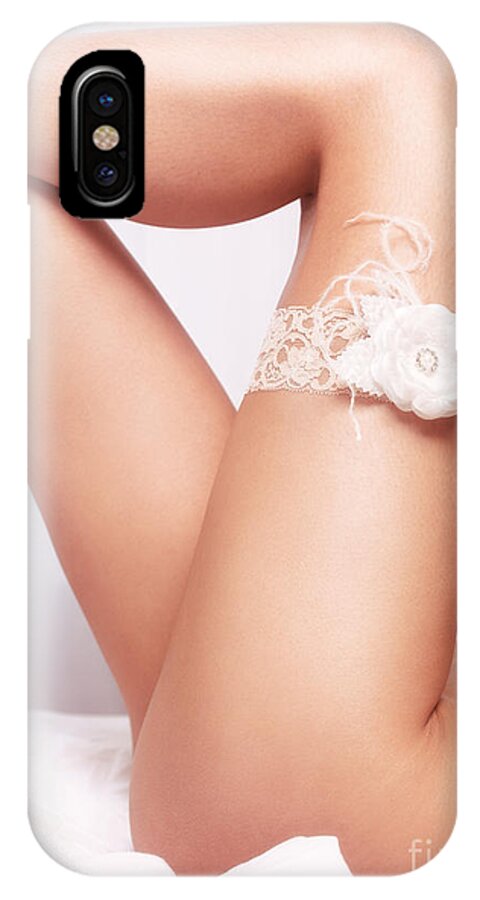 Garter iPhone X Case featuring the photograph Sexy woman legs with bridal garter by Maxim Images Exquisite Prints