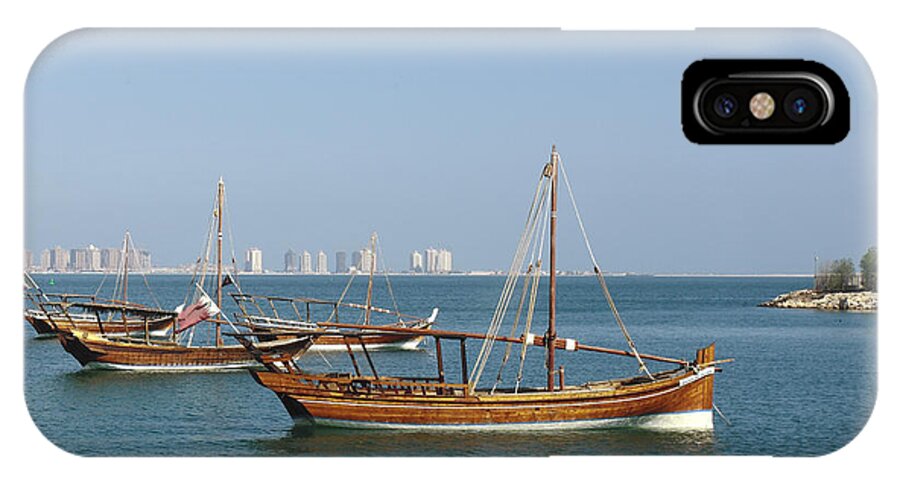 Dhow iPhone X Case featuring the photograph Small dhows and Pearl development by Paul Cowan