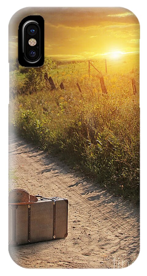 Atmosphere iPhone X Case featuring the photograph Suitcase with hat on road at sunset by Sandra Cunningham