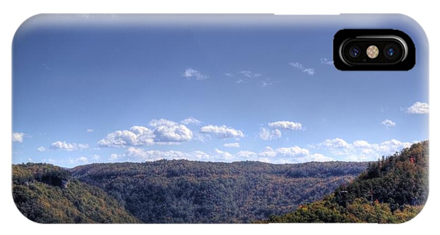 River iPhone X Case featuring the photograph Wide shot of tree covered hills by Jonny D