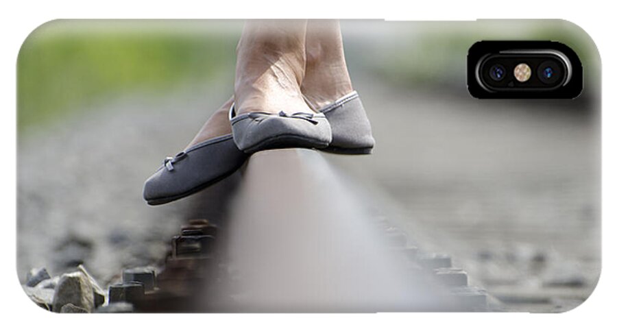 Shoes iPhone X Case featuring the photograph Balance on railroad tracks #1 by Mats Silvan