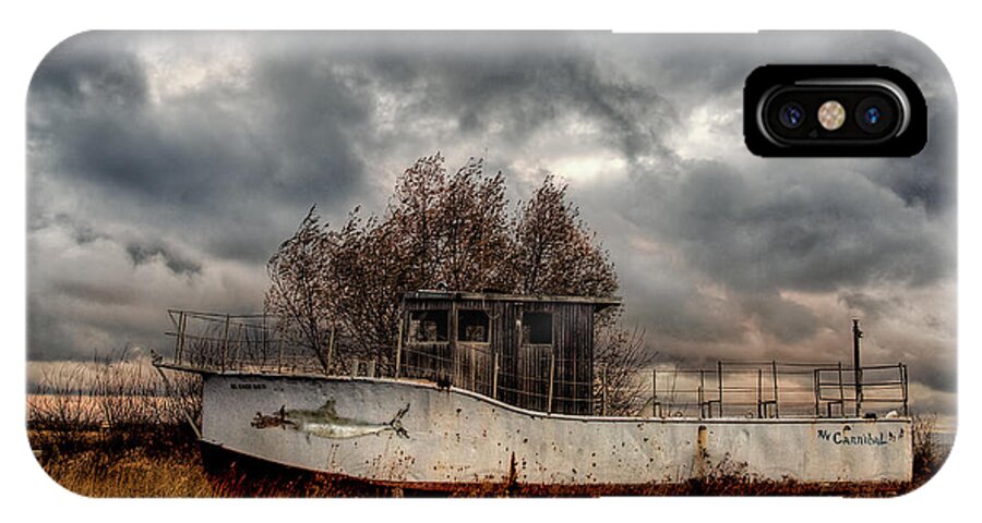 Boat iPhone X Case featuring the photograph The Cannibal by Terry Doyle