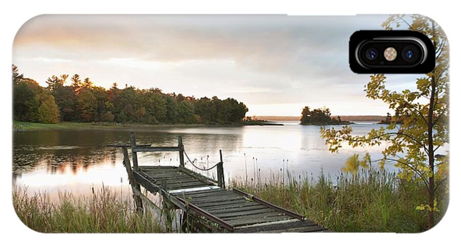 Sunrise iPhone X Case featuring the photograph A Dock On A Lake At Sunrise Near Wawa by Susan Dykstra