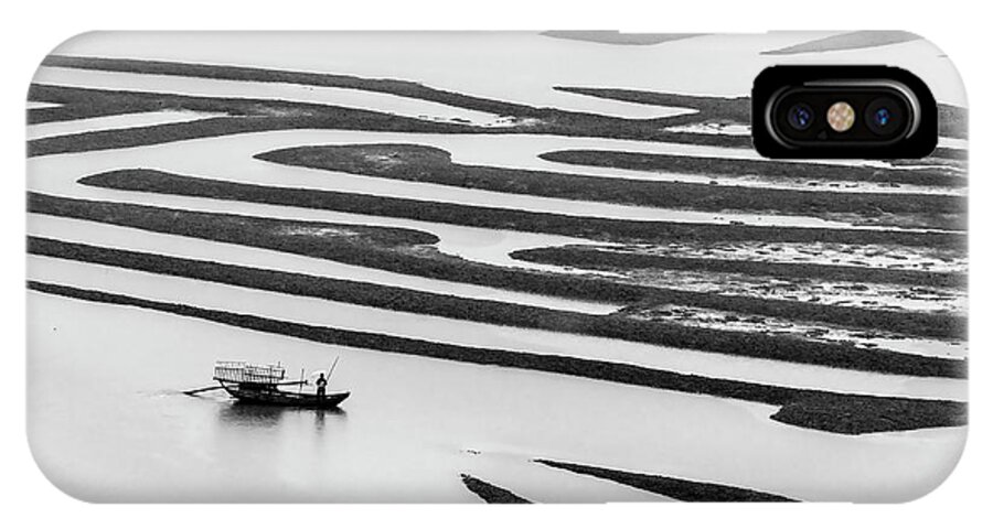 Asia iPhone X Case featuring the photograph A solitary boatman. by Usha Peddamatham