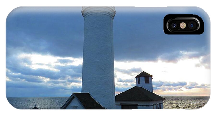 The Light At Tibbetts Point Lighthouse Shines With The December Clouds iPhone X Case featuring the photograph December light, Tibbetts Point by Dennis McCarthy