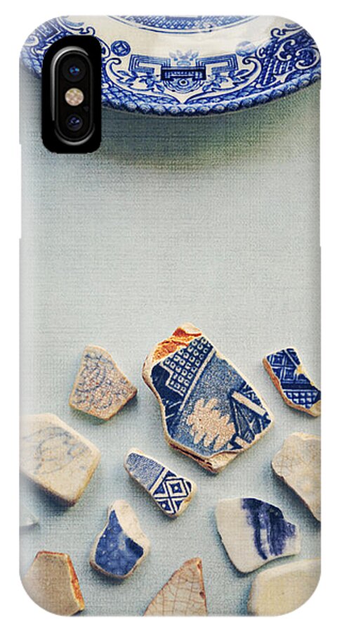 Photograph iPhone X Case featuring the photograph Picking up the broken pieces by Lyn Randle